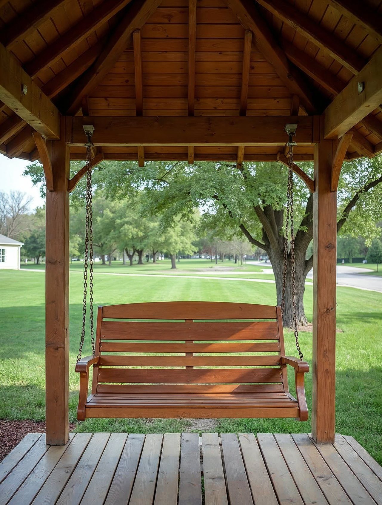 AI illustration: A very long covered porch swing in a green city park in Hebron Nebraska on a sunny day